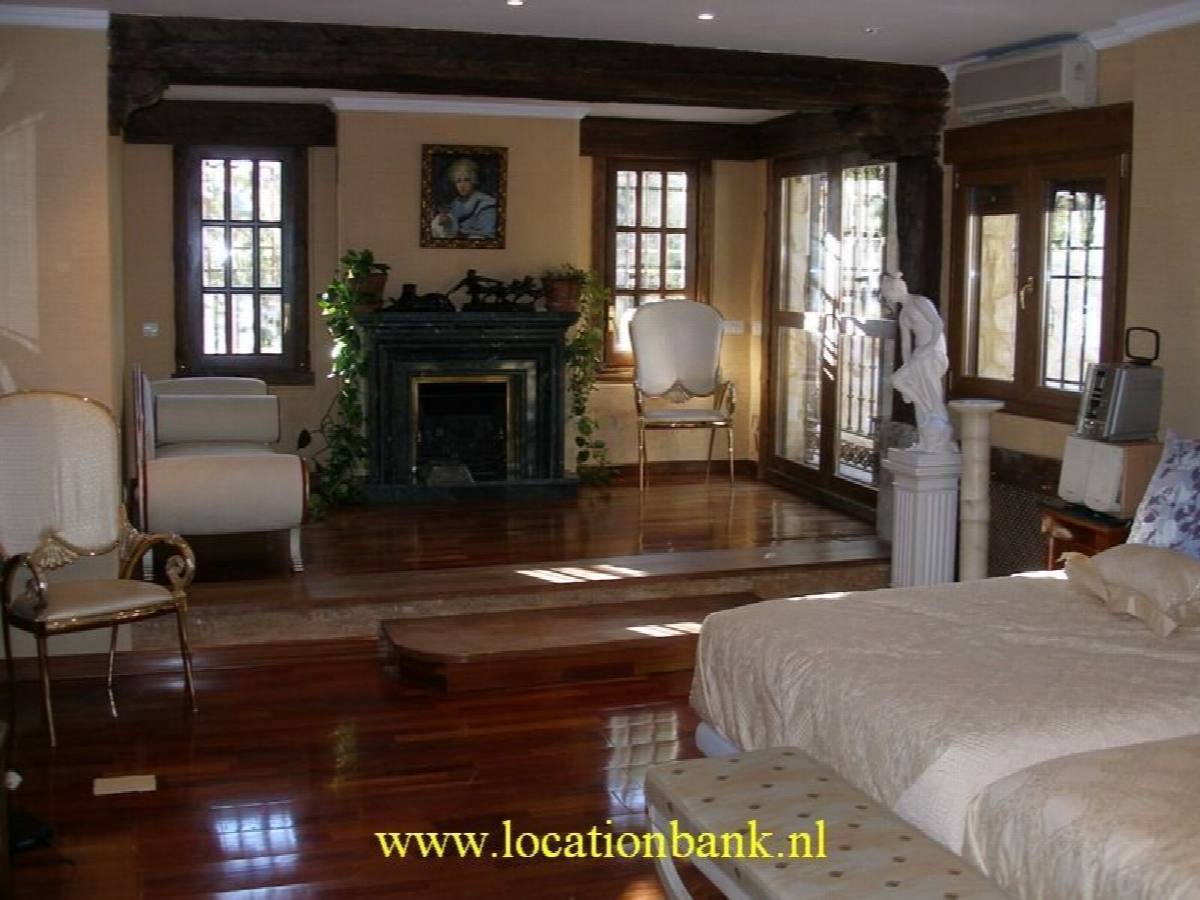 Slaapkamer met open haard