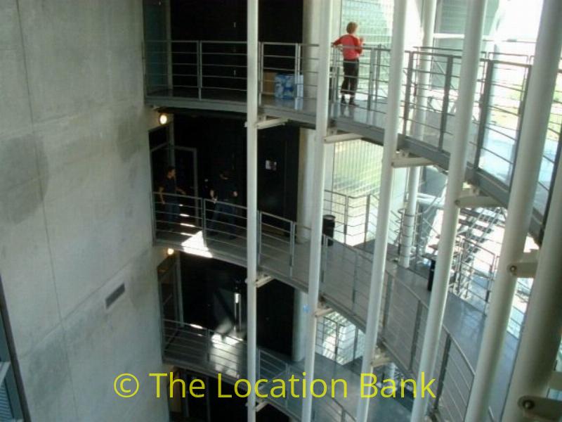 Hichtec office building with beautifull stairs and glass elevator and a terras with a view at the airport