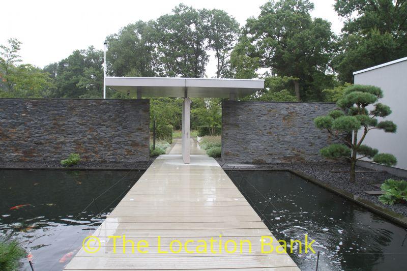 pond with bridge to frontdoor