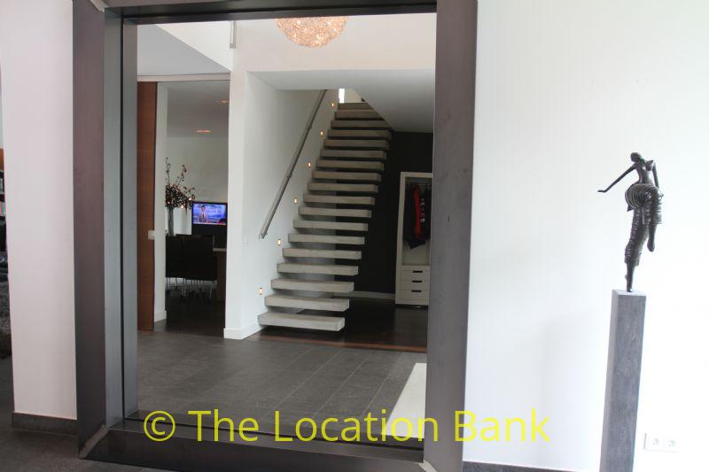 Hallway with mirror and stairway