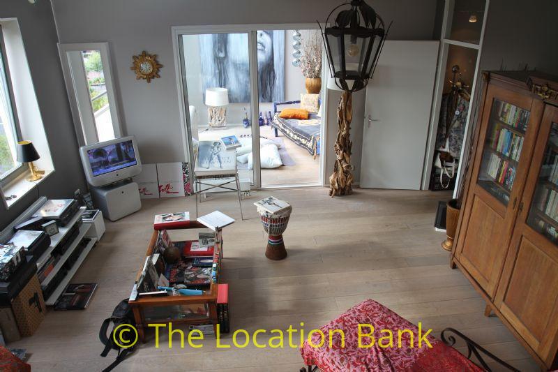Top view of living room wooden floor and gray walls.