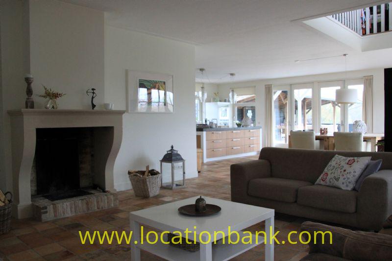 living with fireplace and open kitchen