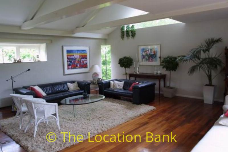 Living with wooden floor and view over landscape
