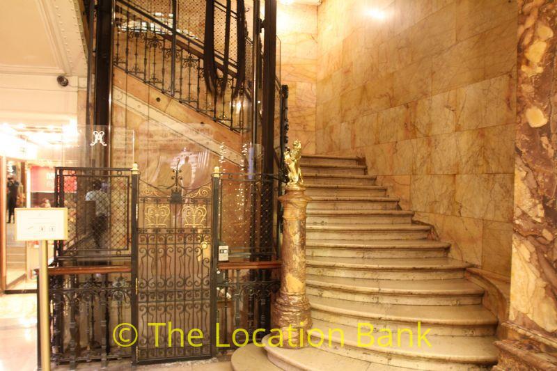 marblke stair with classical elevator