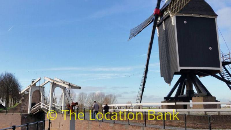 windmill and wooden bridge