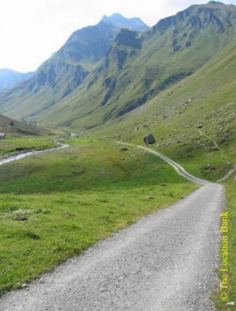 Dirt road in the mountains. Valley road