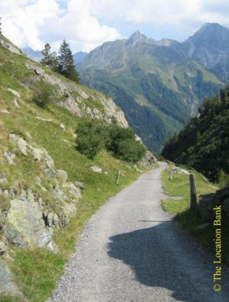 Dirt road in the mountains. Valley road