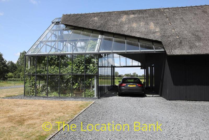 Modern villa with greenhouse or glasshouse