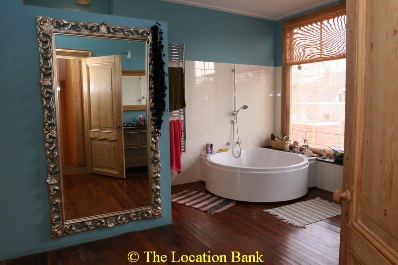 bathroom with a circular bathtub