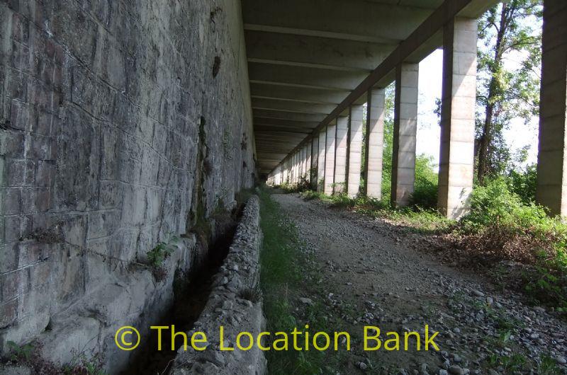 Deserted abandoned railway tunnel with no rail