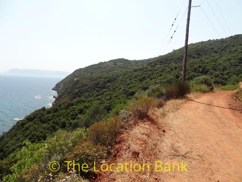 Greek unpaved Straße along the greek sea