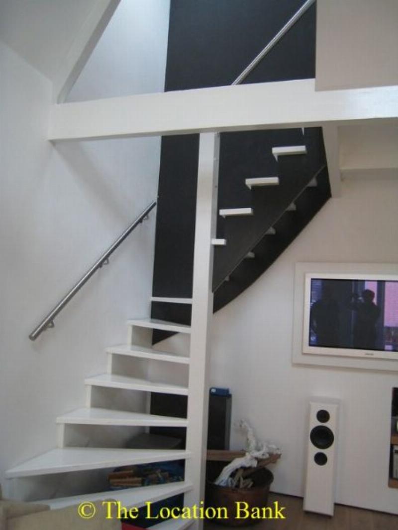 Spiral staircase in modern Dachboden