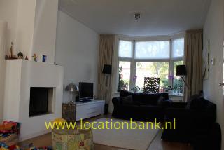 woonkamer met open haard