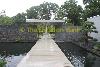 pond with bridge to frontdoor