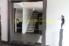 Hallway with mirror and stairway