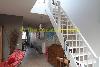 Open staircase in the living room mounted against side wall.