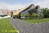 Modern villa with greenhouse or glasshouse