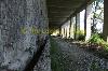 Deserted abandoned railway tunnel with no rail