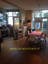 huiskamer met open keuken in Haarlem